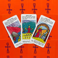 tarot kortos — atverstos Taurių serijos trys kortos (Eight, Nine, Ten) ant ryškiai oranžinių nugarėlių