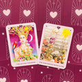 Tarot kortos rožiniais rėmeliais, atverstos The Divine Feminine ir The Distorted Masculine ant bordo nugarėlių, skirtos asmeninei introspekcijai