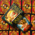 Oracle of Visions kortos (Ciro Marchetti), dvi dėžutės iš viršaus ant raudonų ornamentuotų kortų nugarėlių, variantų demonstracija