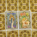 Tarot kortos vintage stiliaus rinkinys su atversta Mergele ir Liūtu kortomis ir auksinėmis raštų nugarėlėmis