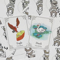 Gyvūnų oracle kortos su erelio (Freedom) ir antis (Flexibility) spalvotomis iliustracijomis, detalus kampinis rėmelis ir galinių kortų nugarėlių dizainas