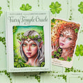 Orakulo kortos Faery Temple (Suzy Cherub) žaliame dėkle su viena atidengta korta, rodantis dėklo priekinį viršelį ir kortų iliustracijas