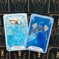 tarot kortos dviejų kortų rinkinys: Karalius ir Karalienė Lazdų, mėlyni larimar ir tanzanit motyvai ant juodo raštuoto fono