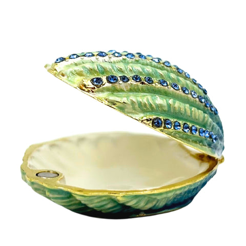 Kriauklės formos metalinė papuošalų dėžutė su mėlynais kristalais