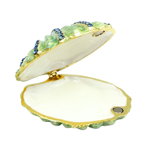 Kriauklės formos metalinė papuošalų dėžutė su mėlynais kristalais