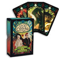 Tarot kortos Good Omens dėžutėje su spalvotu iliustruotu viršeliu ir trimis išskleistomis kortomis, parodytomis priekyje
