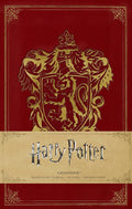 Gryffindor užrašų knygelė tamsiai raudonu dirbtinės odos viršeliu su auksiniu erelio herbu, kišeninio formato