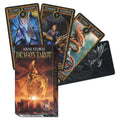 Dragon Tarot kortos Anne Stokes, dėžutė priekyje ir fanuotos kortos su spalvingomis drakonų iliustracijomis