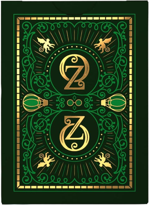 kortų nugarėlė tamsiai žalia su ryškiomis aukso Z monogramomis, simetrišku ornamentiniu raštu ir fone skriejančiais elementais
