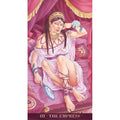 tarot korta Imperatorienė: pilnai matoma rožinė iliustracija su valdovės poza, veidrodžiu, auksiniais papuošalais ir lovos uždanga