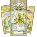 Mystic Faerie Tarot kortų kaladė su Linda Ravenscroft iliustracijomis, žalsvai geltonu viršeliu, dėžutė priekyje ir kelios kortos išfanuotos