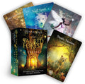oracle kortos The Sacred Forest Denise Linn, 52 kortos su dėžute, atverta dėžutė ir išskleistos iliustruotos kortos, matomas švytintis medžio durų viršelis ir lokio korta