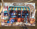 Siuvinėta drobė "Magic Shop" mažo formato, frontali kompozicija su žaliu tentu, rudeniškais moliūgais ir priekyje žirklių rekvizitu
