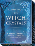 Knyga Witch Crystals Barbara Moore, mėlynas viršelis su medžių rėmu, priekinis kampas ir matoma nugarėlė